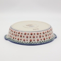 Round ceramic platter with handles A525 D139 – hand-painted Bolesławiec pottery in a traditional pattern, elegant and functional for serving dishes.