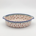 Round ceramic platter with handles A525 D139 – hand-painted Bolesławiec pottery in a traditional pattern, elegant and functional for serving dishes.