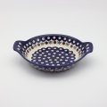 Round baking dish with handles made of Boleslawiec pottery.