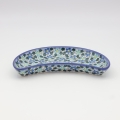 Hand-decorated Bolesławiec pottery – crescent tray, elegant table decoration.