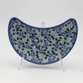 Hand-decorated Bolesławiec pottery – crescent tray, elegant table decoration.