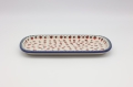 Boleslawiec rectangular ceramic platter CH on table – traditional Polish serving dish.
