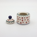 Detail of hand-painted decoration on Boleslawiec sugar bowl with lid.