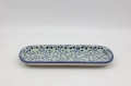 Hand-painted ceramic serving platter made from traditional Bolesławiec pottery. Perfect for serving food and decorating the table.