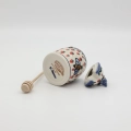 Hand-painted honey pot made from traditional Bolesławiec pottery. A stylish and practical container perfect for storing and serving honey.