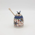 Hand-painted honey pot made from traditional Bolesławiec pottery. A stylish and practical container perfect for storing and serving honey.