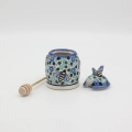 Hand-painted honey pot made from traditional Bolesławiec pottery. A stylish and practical container perfect for storing and serving honey.