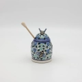 Hand-painted honey pot made from traditional Bolesławiec pottery. A stylish and practical container perfect for storing and serving honey.