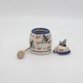 Hand-painted honey pot made from traditional Bolesławiec pottery. A stylish and practical container perfect for storing and serving honey.