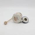 Hand-painted honey pot made from traditional Bolesławiec pottery. A stylish and practical container perfect for storing and serving honey.