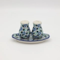 Hand-painted salt and pepper shakers with tray made from traditional Bolesławiec pottery. A stylish set perfect for everyday use and elegant table settings.