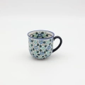 Hand-painted cup made from traditional Bolesławiec pottery. Elegant and functional, perfect for serving coffee and tea for everyday use or special occasions.