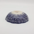 Add a touch of floral elegance to your table with the flower-shaped bowl. This unique piece from Bolesławiec stands out with its scalloped edges resembling delicate petals and intricate, hand-painted patterns.