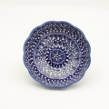 Add a touch of floral elegance to your table with the flower-shaped bowl. This unique piece from Bolesławiec stands out with its scalloped edges resembling delicate petals and intricate, hand-painted patterns.