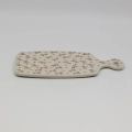 This versatile piece is a stylish alternative to wooden boards, offering superior durability and a timeless look. Featuring a convenient handle with a hanging hole, it doubles as a beautiful wall decoration when not in use.