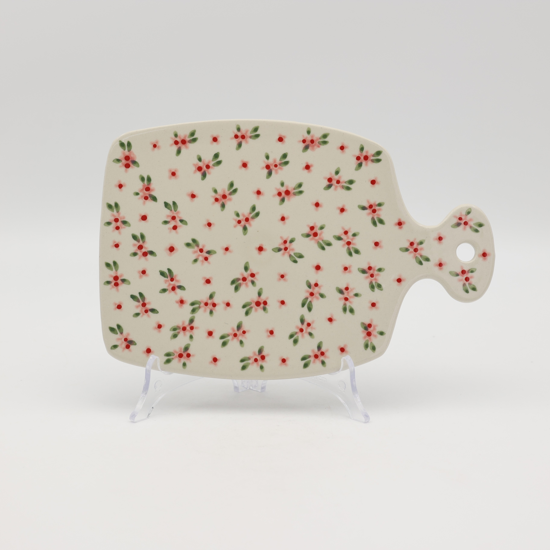This versatile piece is a stylish alternative to wooden boards, offering superior durability and a timeless look. Featuring a convenient handle with a hanging hole, it doubles as a beautiful wall decoration when not in use.